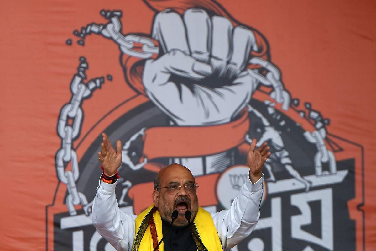 Union Minister Amit Shah addresses supporters of Bharatiya Janata Party (BJP) during a political rally organised to celebrate the new citizenship law in Kolkata on March 1, 2020. (AFP Photo)