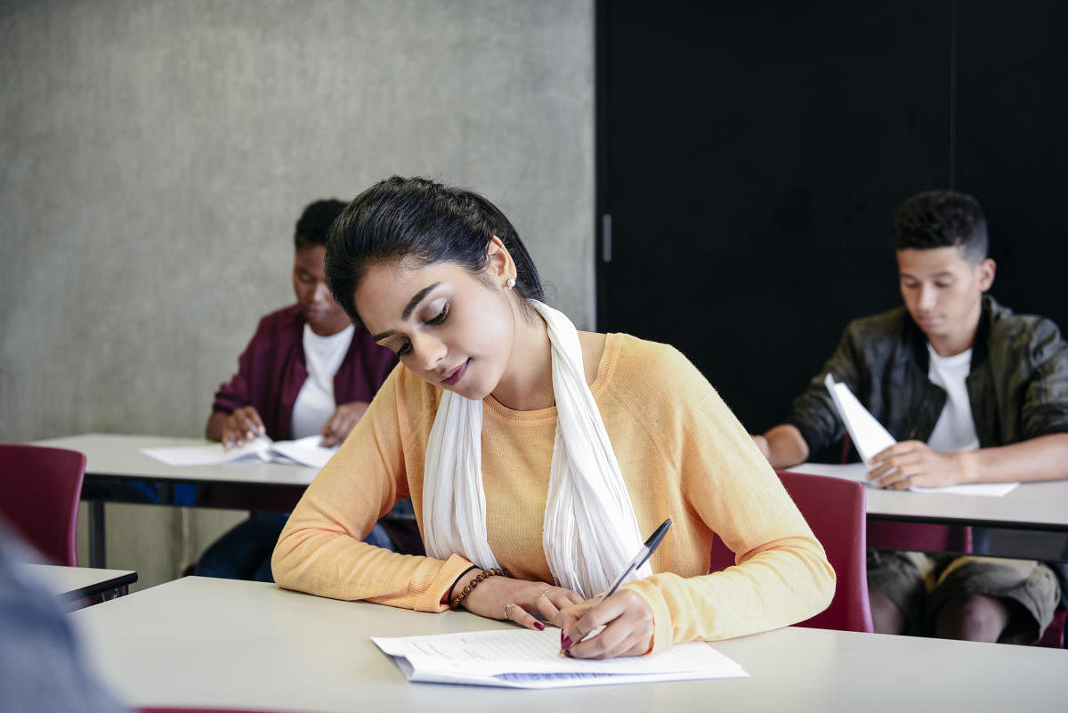 Question papers of the Secondary School Leaving Certificate preparatory examinations were leaked in Bengaluru, Ballari and Kolar and circulated on WhatsApp hours before the exams. (Representative picture of exam from Getty images)