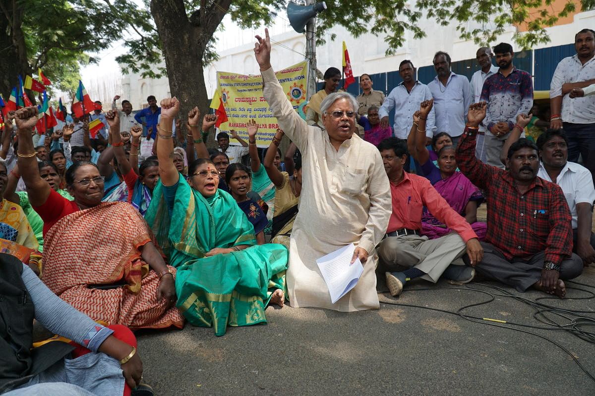 Construction workers and KSCWCU representatives, including president N P Swamy (centre) protest the central government's plans to replace the BOCW with the new Draft Labor Codes 2019 which will some of benefits removed. Photo taken on March 3, 2020.