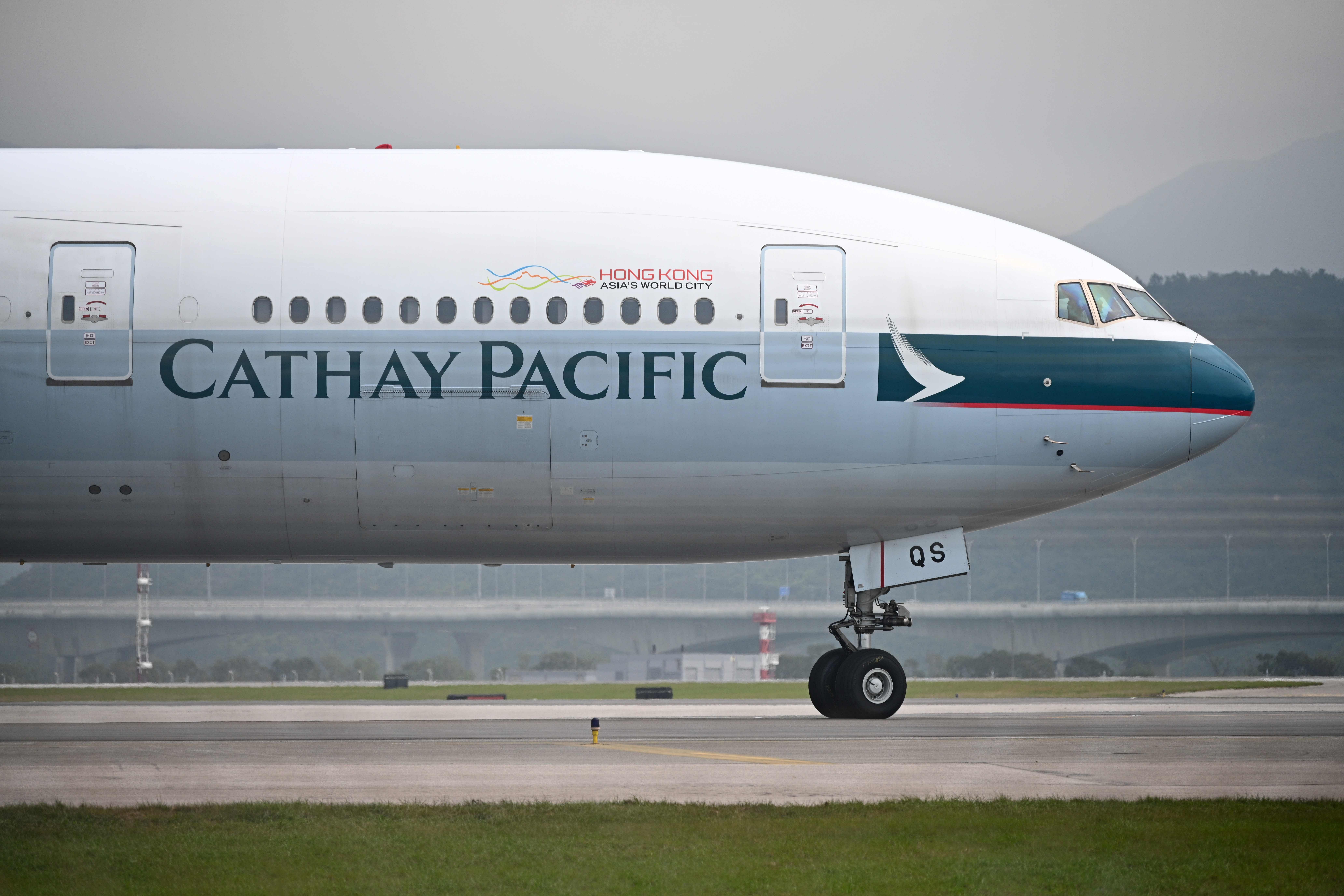In this file photo taken on March 13, 2019, a Cathay Pacific passenger plane prepares to take off from Hong Kong's international airport. (Credit AFP)