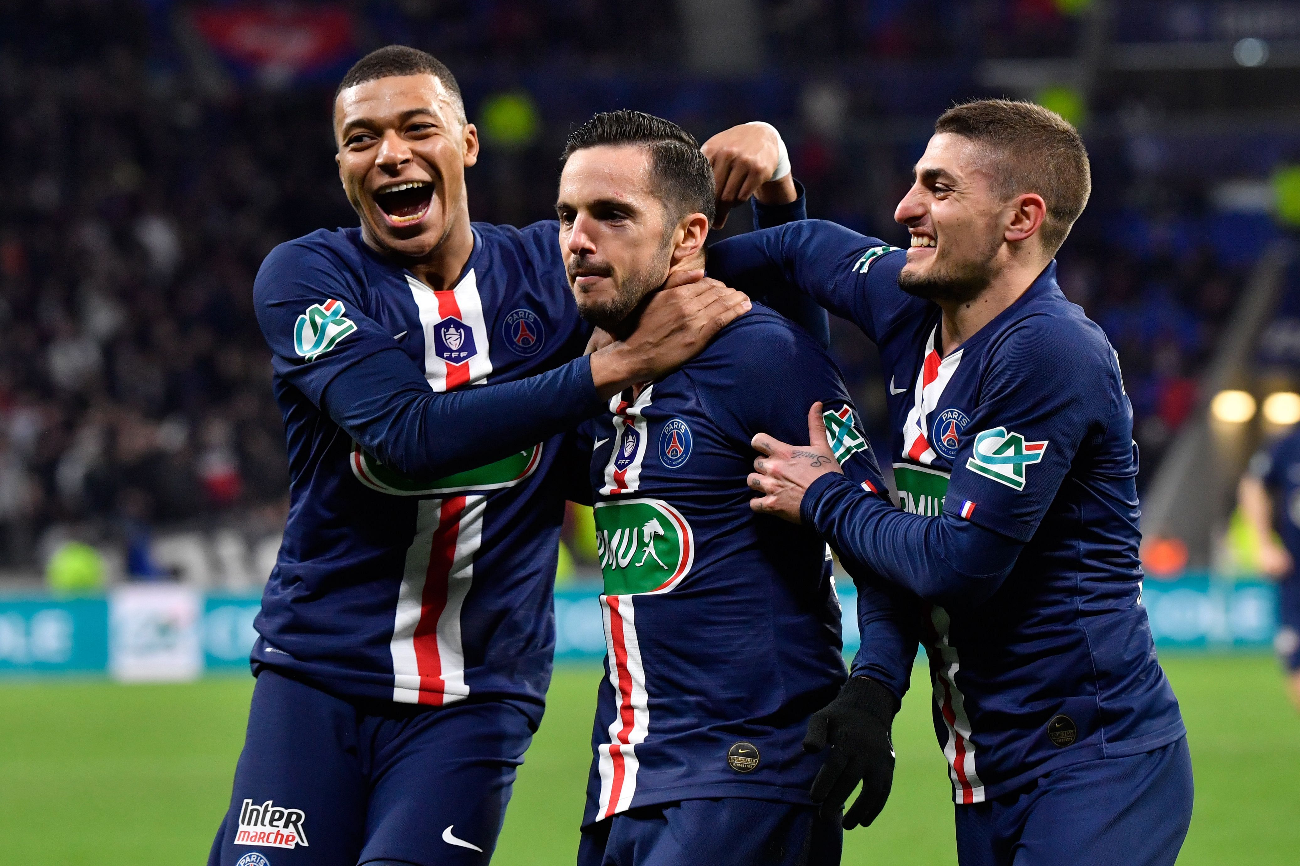 Paris Saint-Germain's Spanish midfielder Pablo Sarabia (C) is congratulated by Paris Saint-Germain's French forward Kylian Mbappe (L) and Paris Saint-Germain's Italian midfielder Marco Verratti after scoring a goal during the French Cup semi-final football match between Olympique Lyonnais (OL) and Paris Saint-Germain (PSG) at the Groupama Stadium in Decines-Charpieu, centraleastern France. (AFP Photo)