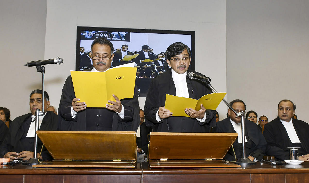 Chief Justice of Punjab and Haryana High Court, Justice Ravi Shankar Jha administers the oath of office to Justice S Muralidhar (R) as Punjab and Haryana High Court Judge(PTI Photo)