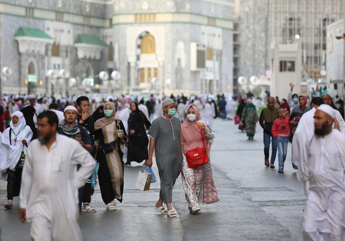 Muslim pilgrims wear masks at the Grand Mosque in Saudi Arabia's holy city of Mecca on February 28, 2020. Credit: AFP Photo