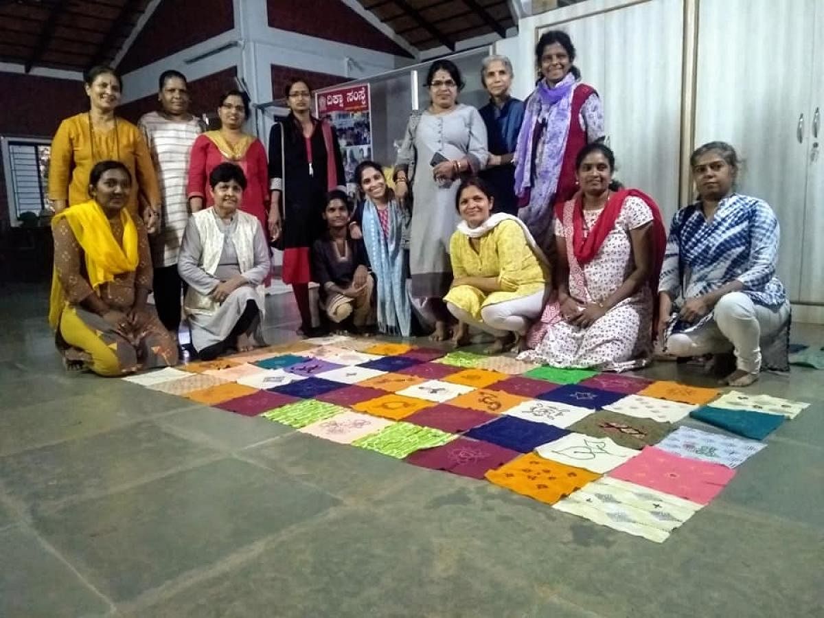 Quilters from Karnataka Rajya Mahila Dourjanya Virodhi Okkuta, a women’s organisation, with their handiwork.