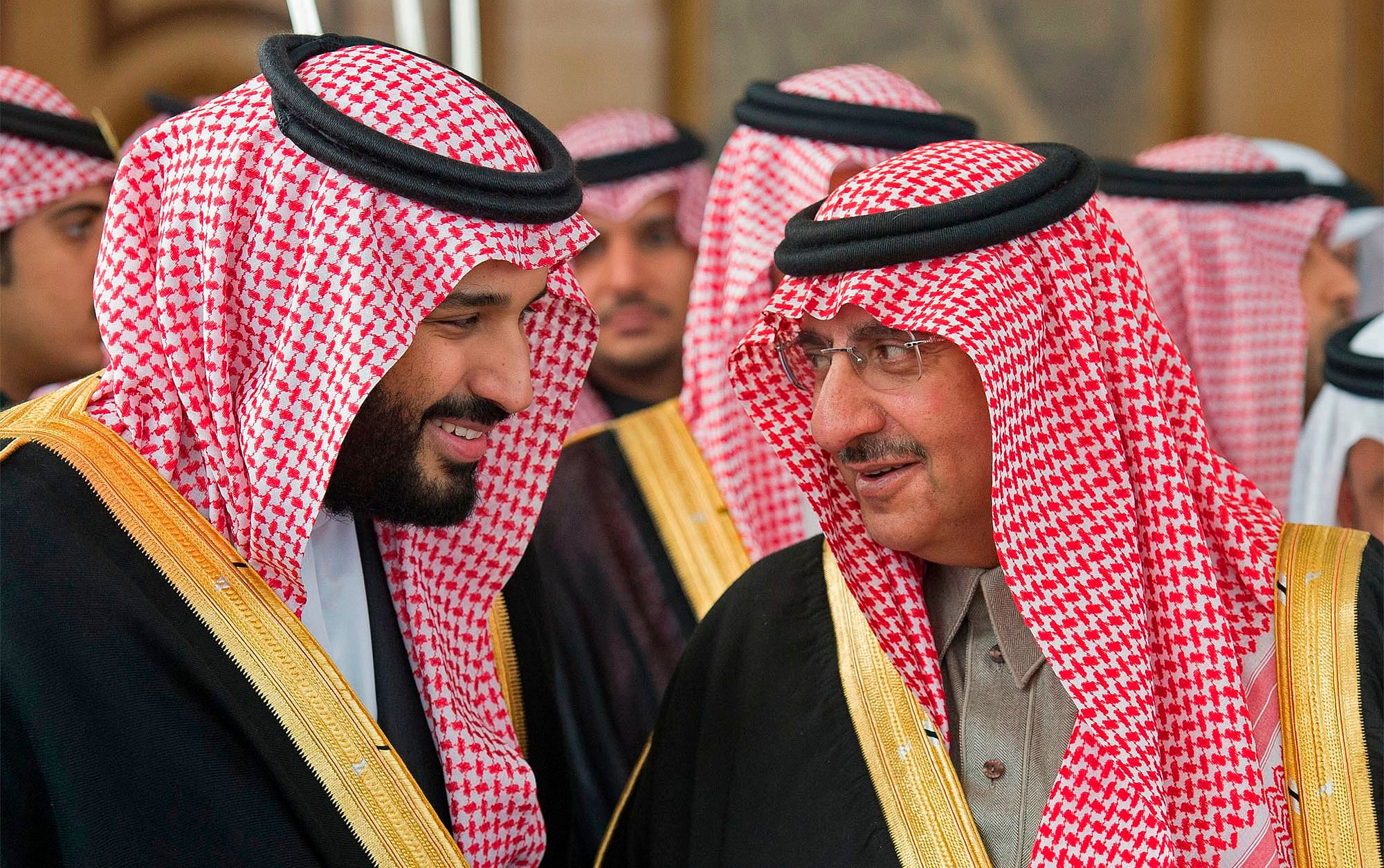 A handout picture release by Saudi Royal Palace on December 14, 2016 shows Saudi Crown Prince Mohammed bin Nayef (R) speaking with deputy Crown Prince Mohammed bin Salman during the opening session of the Shura Council in Riyadh. (AP)