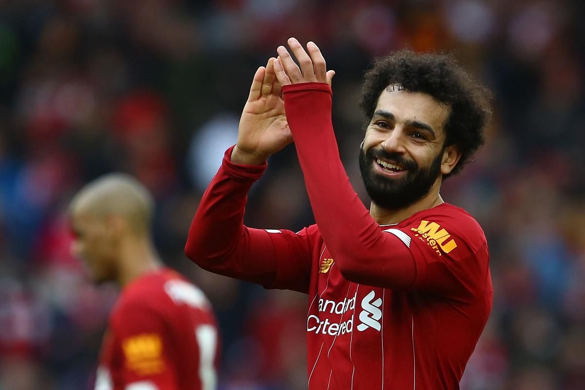 Liverpool's Egyptian midfielder Mohamed Salah reacts at the final whistle during the English Premier League football match between Liverpool and Bournemouth at Anfield in Liverpool. AFP