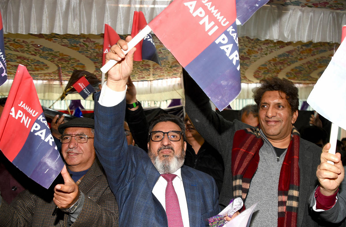  President of newly launched Jammu and Kashmir Apni Party, Altaf Bukhari (C) with other party members hold the party flag (PTI  Photo)