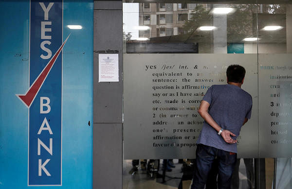 A customer tries to look into a Yes Bank branch in Mumbai. (Reuters Photo)