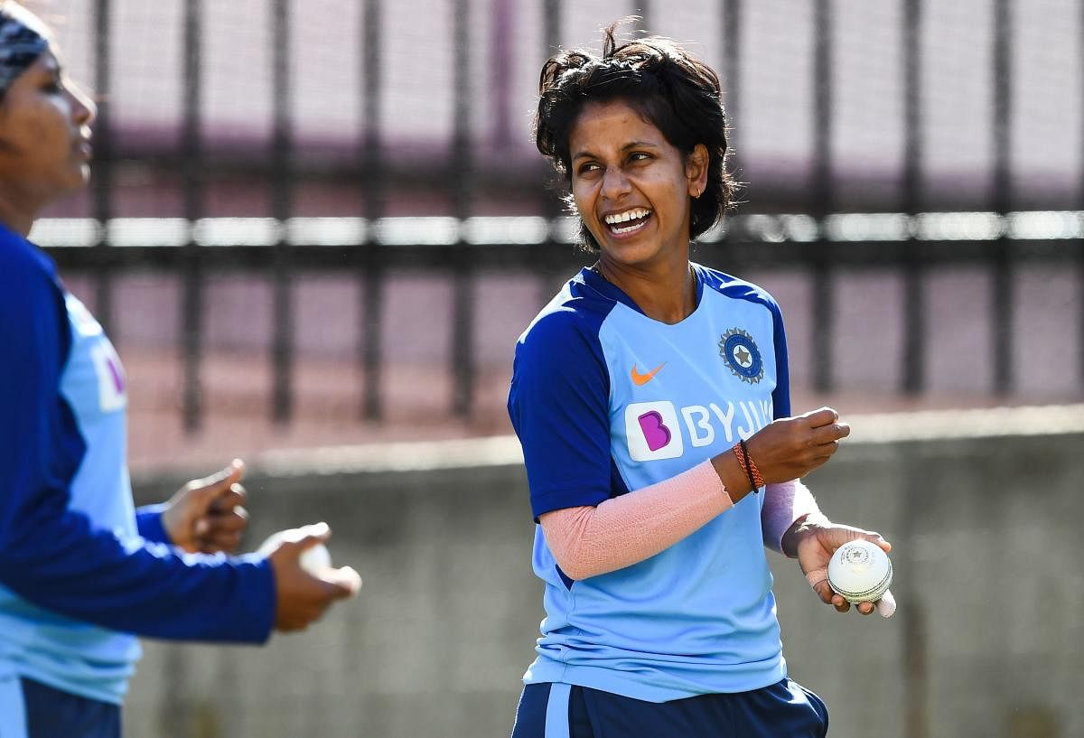 India's Poonam Yadav (R) trains in the nets ahead of the Twenty20 women's World Cup cricket final, in Melbourne on March 7, 2020. (Photo by AFP)