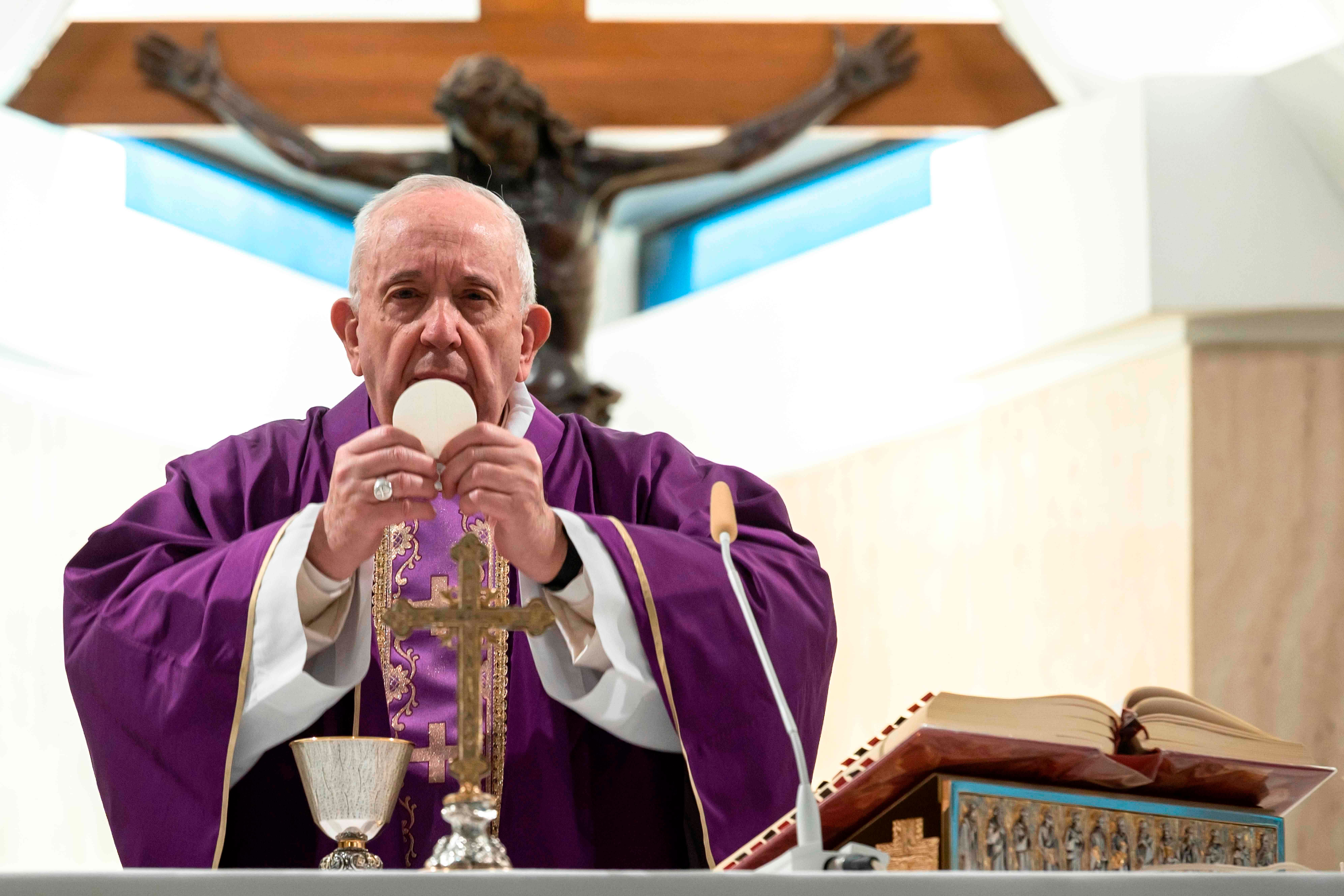 This photo taken and handout on March 10, 2020 shows Pope Francis celebrating a daily mass alone in the Santa Marta chapel at the Vatican, as part of precautionary measures against the spread of the new coronavirus. (Credit: AFP Photo)