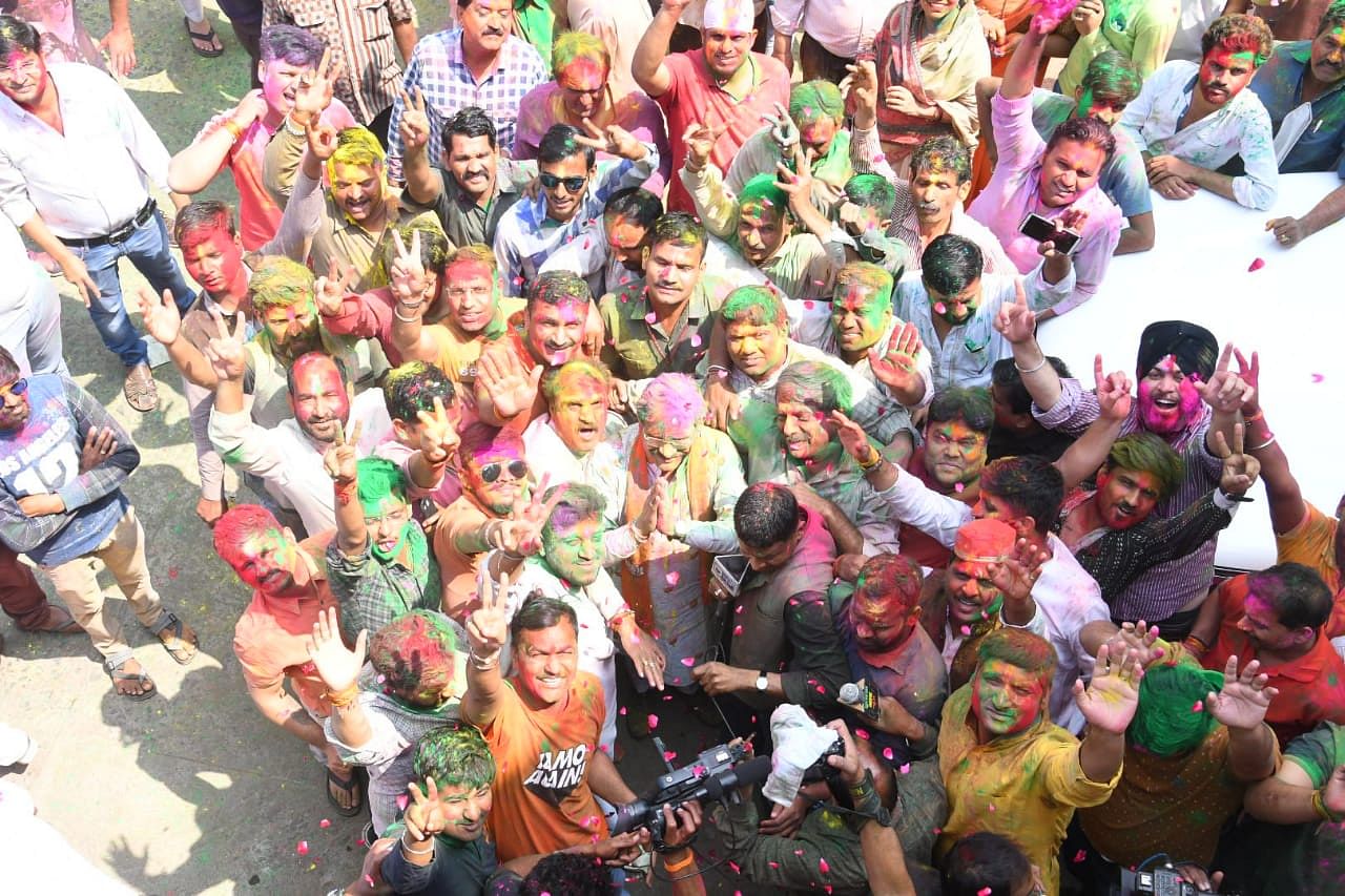 Scores of BJP workers, including women, danced and smeared each other with colours to mark the festival of Holi. Credit: Twitter (@BJP4MP)