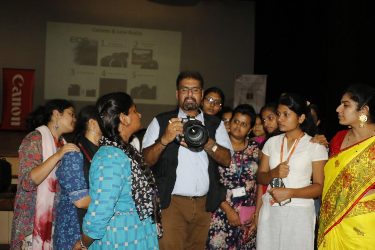 Students learning the basics of photography with Astro Mohan.