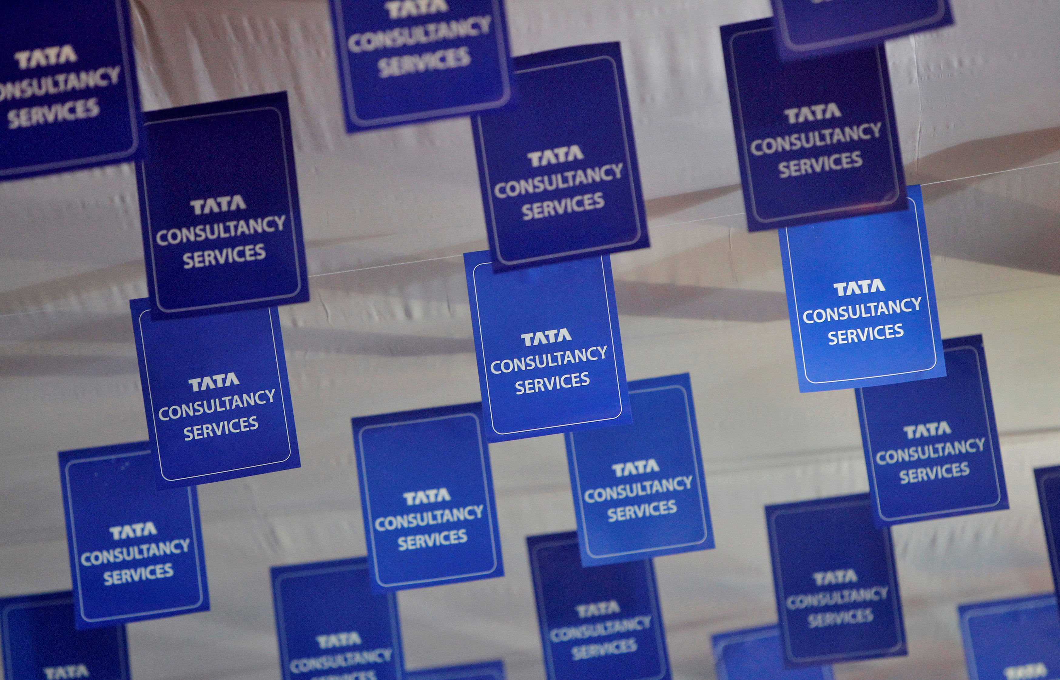 Logos of Tata Consultancy Services (TCS) are displayed at the venue of the annual general meeting of the software services provider in Mumbai. (Credit: Reuters)