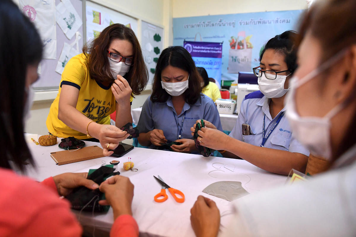 Women take part in a workshop to learn how to make face masks to protect against coronavirus in Bangkok, Thailand. (Reuters photo)