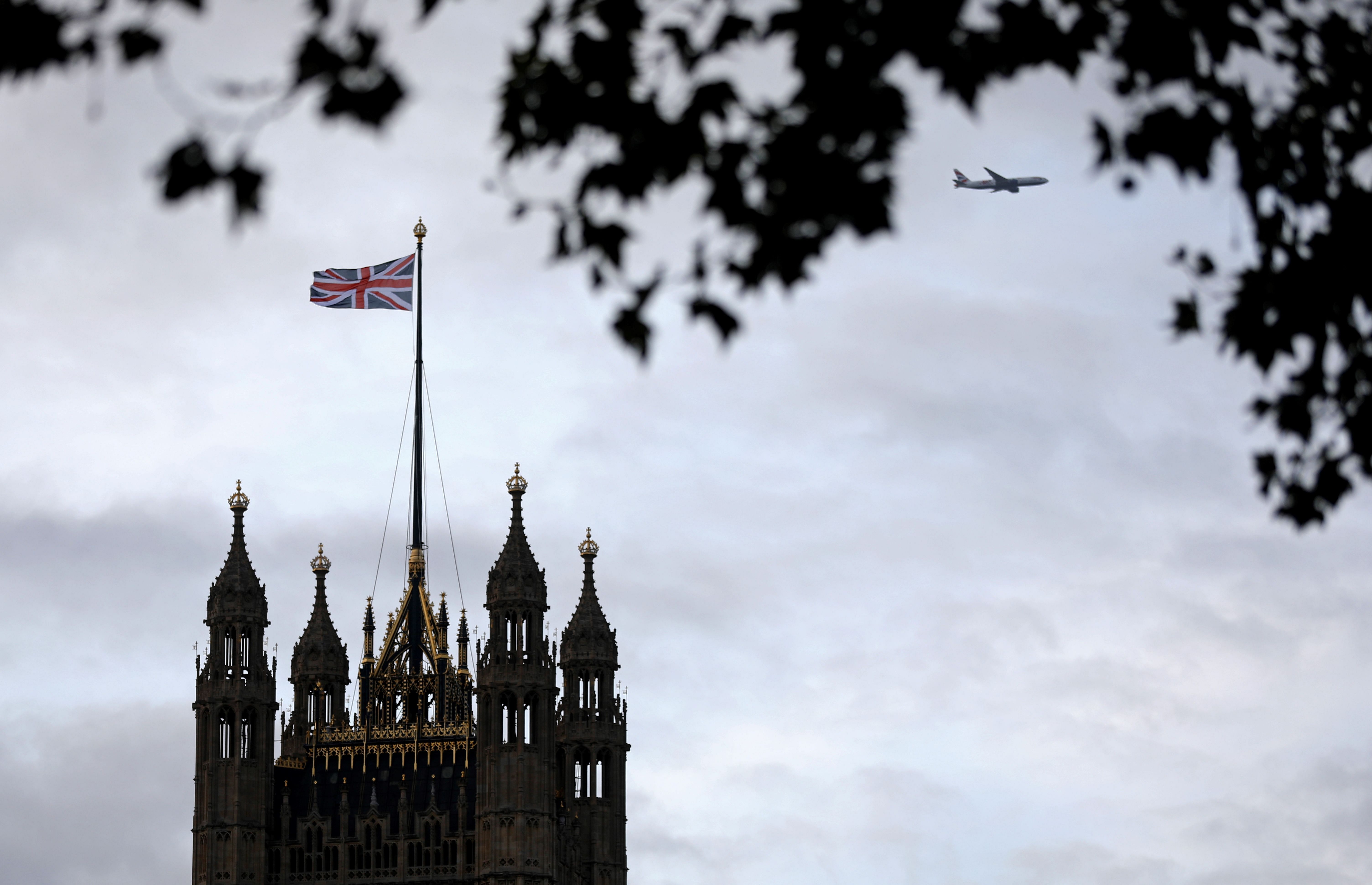 A Union flag flies from a pole atop the Victoria Tower at the Houses of Parliament in London on October 9, 2019. (Credit: AFP)