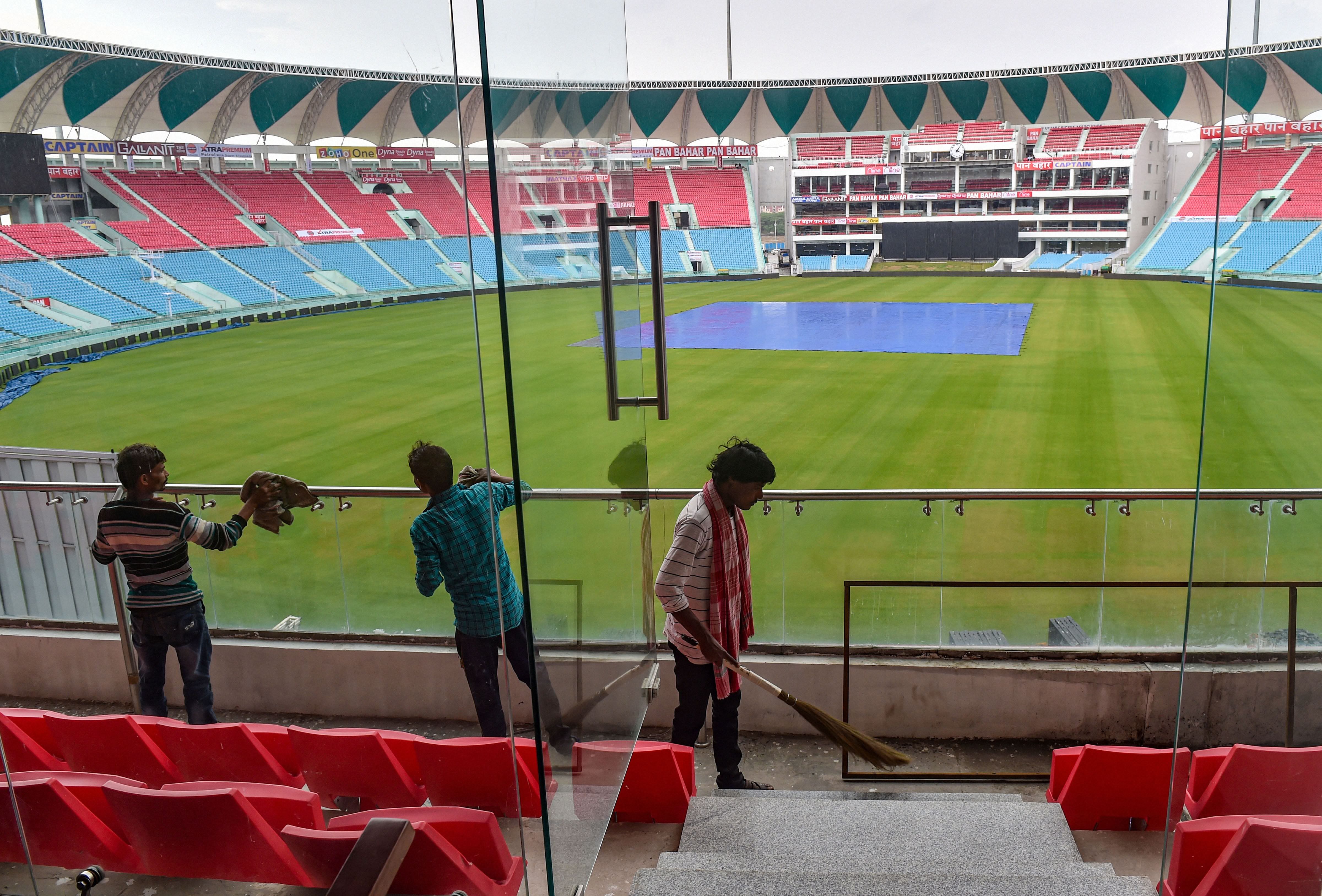 Workers clean a railing of Bharat Ratna Shri Atal Bihari Vajpayee Ekana Cricket Stadium, where the 2nd ODI match between India and South Africa was scheduled, in Lucknow. (PTI Photo)