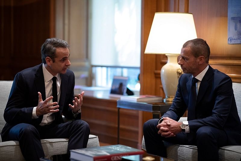 Greek Prime Minister Kyriakos Mitsotakis meets with UEFA President Aleksander Ceferin and FIFA vice-president Greg Clarke (not pictured) in his office at the Maximos Mansion in Athens, Greece. (Reuters Photo)