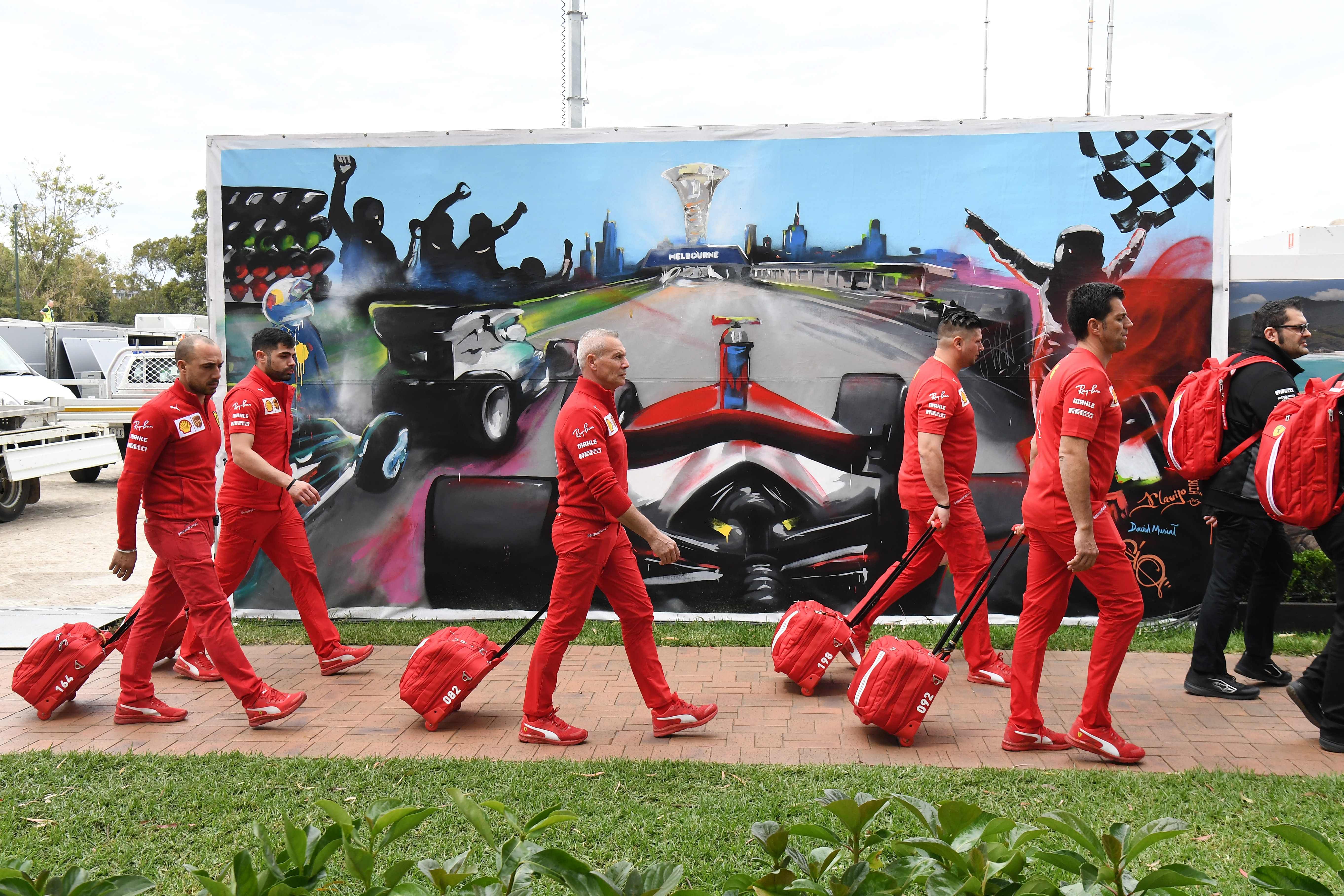 Members of the Ferrari team arrive to pack up their equipment after the Formula One Australian Grand Prix was cancelled in Melbourne on March 13, 2020. (Credit: AFP)