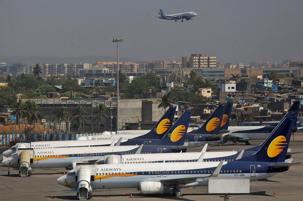 Jet Airways aircrafts are seen parked as an IndiGo Airlines aircraft prepares to land at the Chhatrapati Shivaji Maharaj International Airport in Mumbai, India, April 18, 2019. (Reuters Photo)