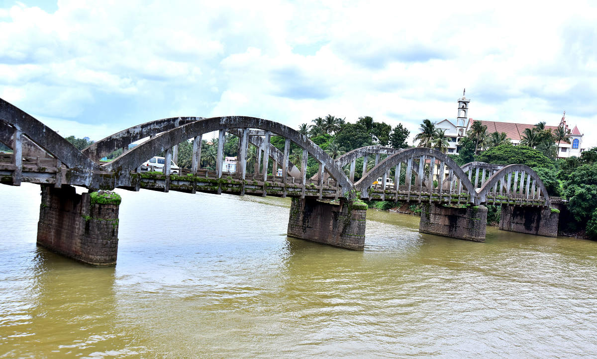 The old arch bridge at Kuloor in Mangaluru. DH Photo/Govindraj Javali