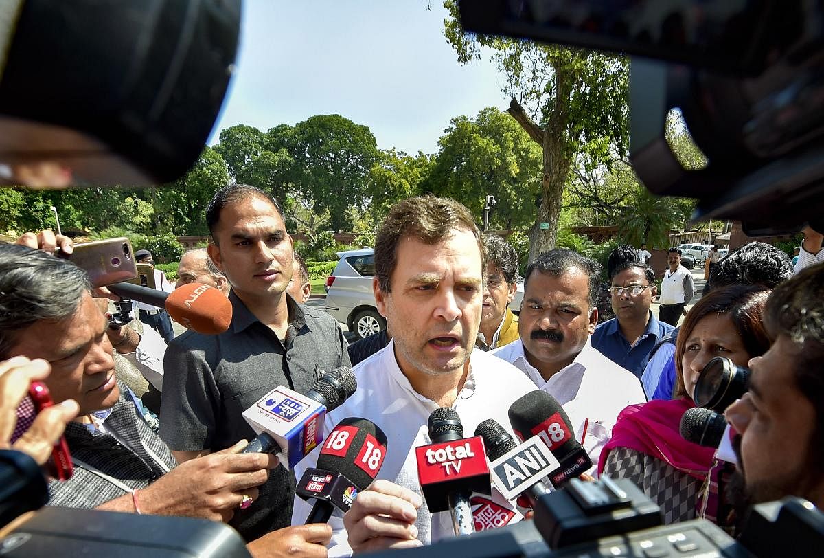 'Indian economy will be devastated. It is like a tsunami is coming,' the former Congress president told reporters outside Parliament. Credit: PTI Photo