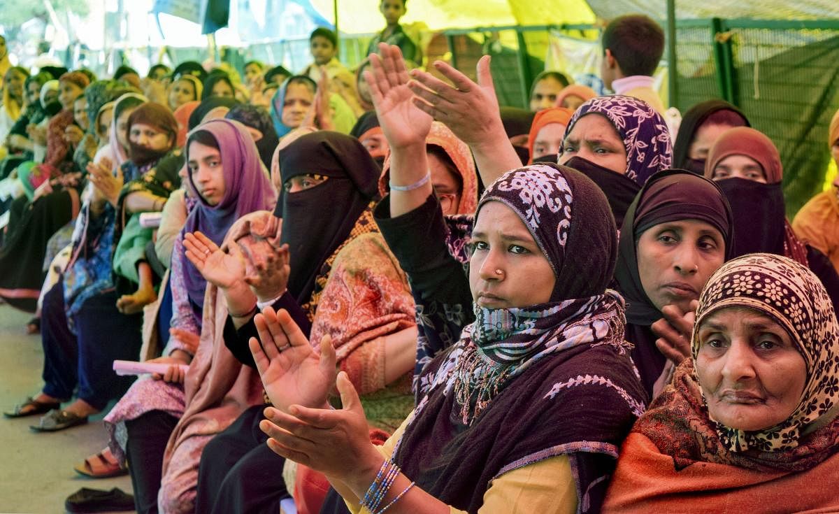 Women during a sit-in demonstration against CAA and NRC on International Women's Day at Shaheen Bagh in New Delhi, Sunday, March 8, 2020. (PTI Photo)