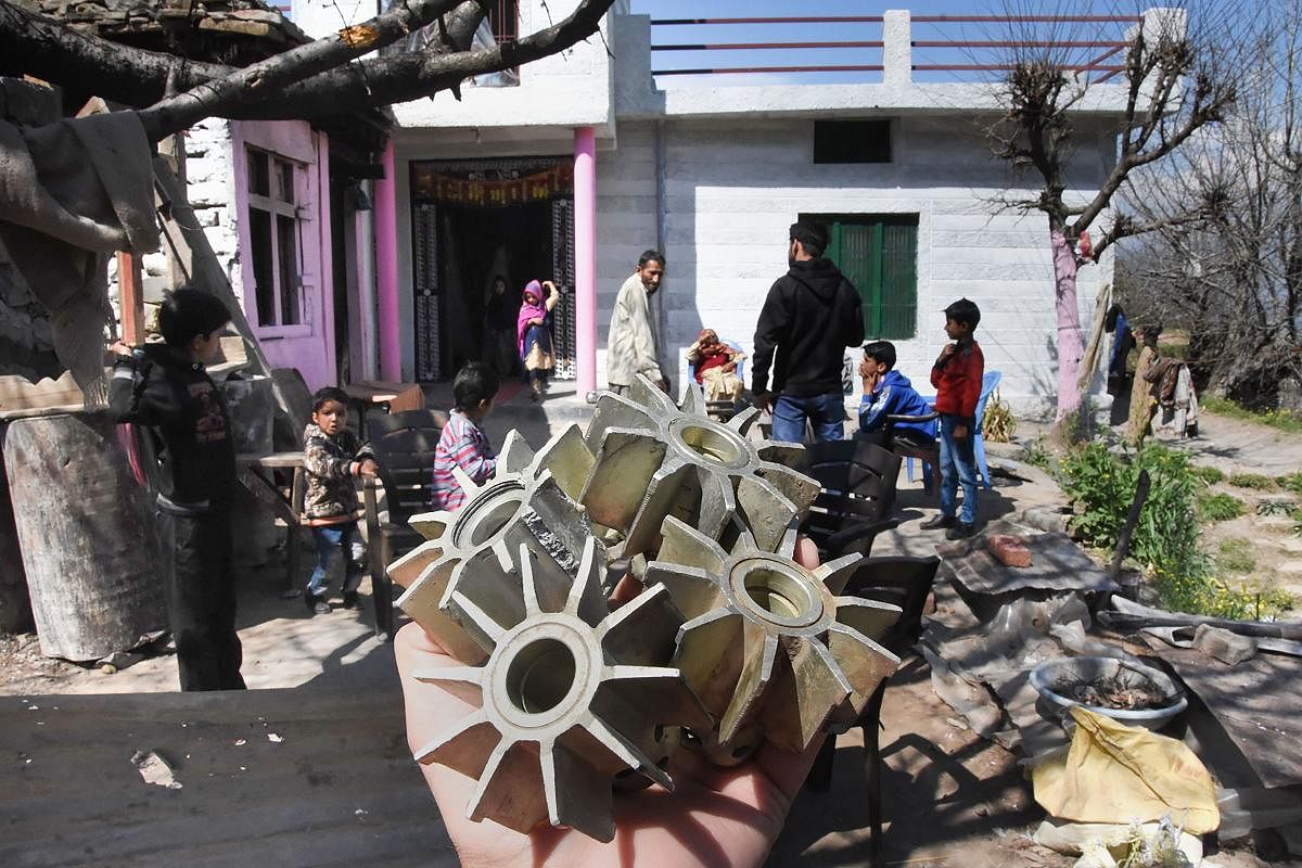 Villagers show the tails of mortar shells after firing by the Pakistani defence forces during wee hours. (PTI Photo)