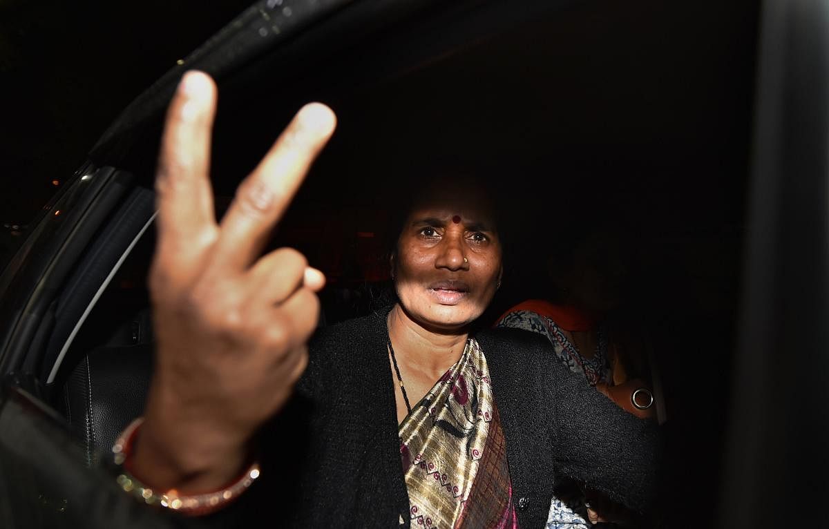 Nirbhaya rape and murder case victim's mother leaves Supreme Court after the apex court dismissed death row convict Pawan Gupta’s plea seeking stay on execution, in New Delhi, Friday morning. (PTI file photo)