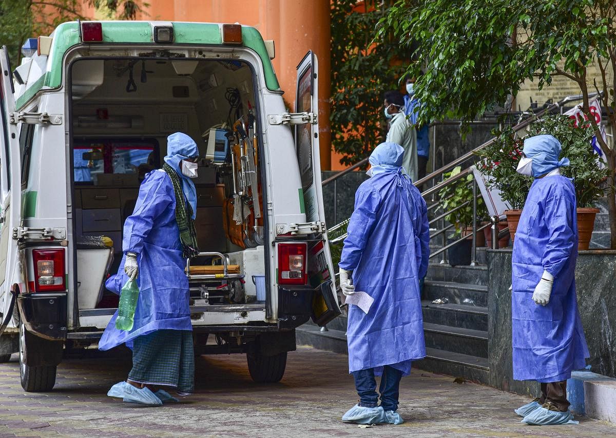 Medical workers attend to a suspected coronavirus patient (PTI Photo)