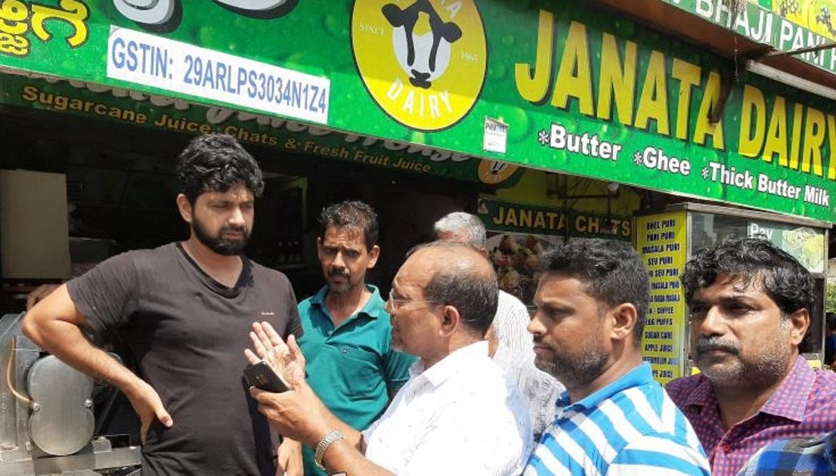 Office-bearers of Central Market Merchants’ Association create awareness on cleanliness at Central Market in Mangaluru.