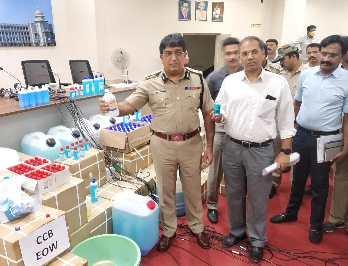 City police chief Bhaskar Rao shows the fake hand sanitisers at a press conference on Friday.