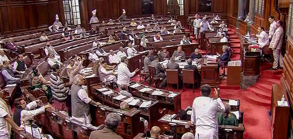  Opposition members protest in the Rajya Sabha during the Budget Session of Parliament, in New Delhi, Wednesday, March 18, 2020. (PTI Photo)