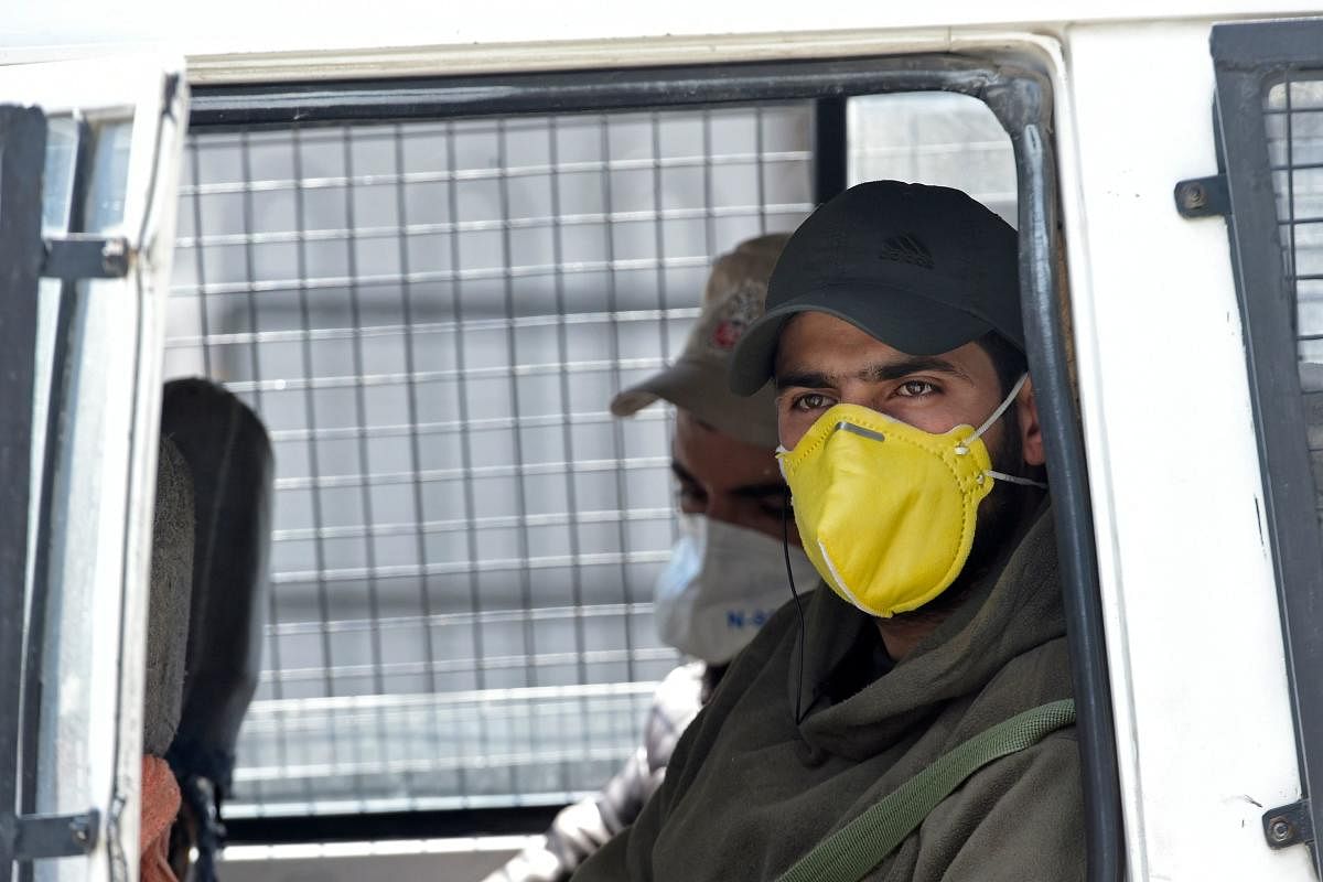 Security personnel wearing facemasks (AFP Photo)