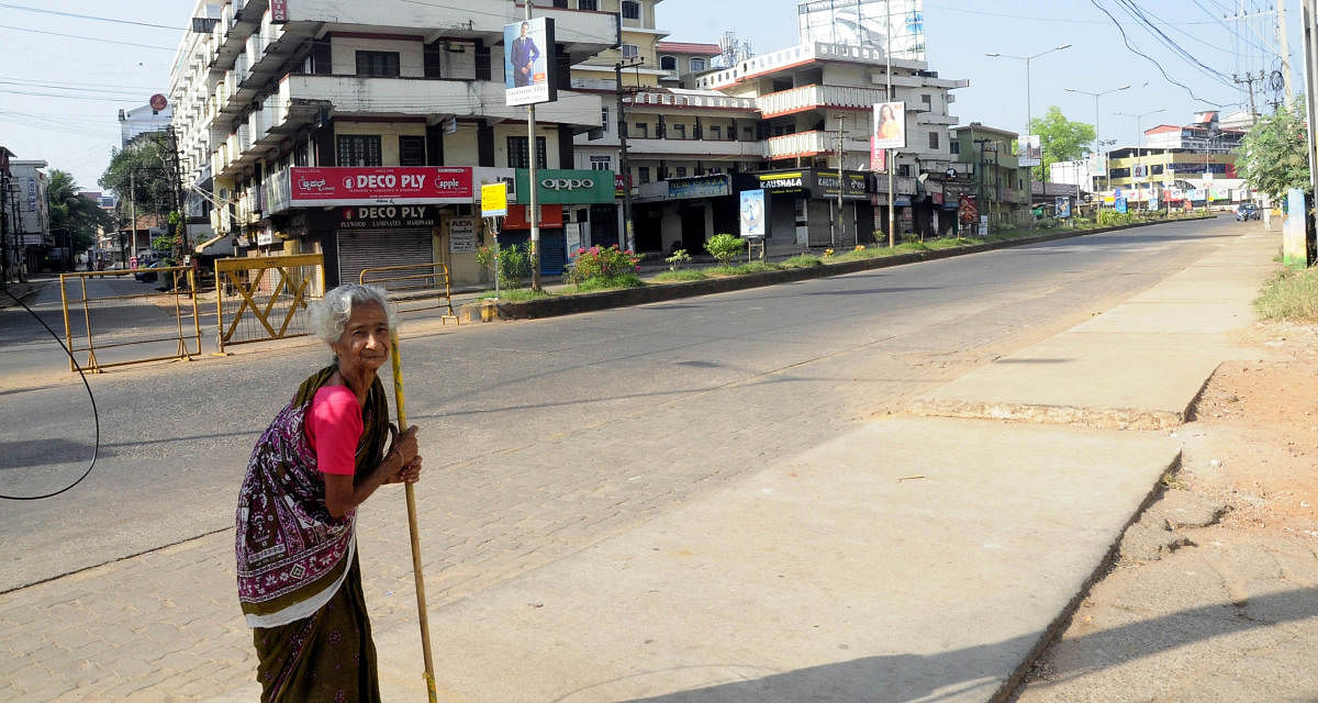A lone senior citizen seen on the road in Manipal in Udupi on Sunday. DH Photo