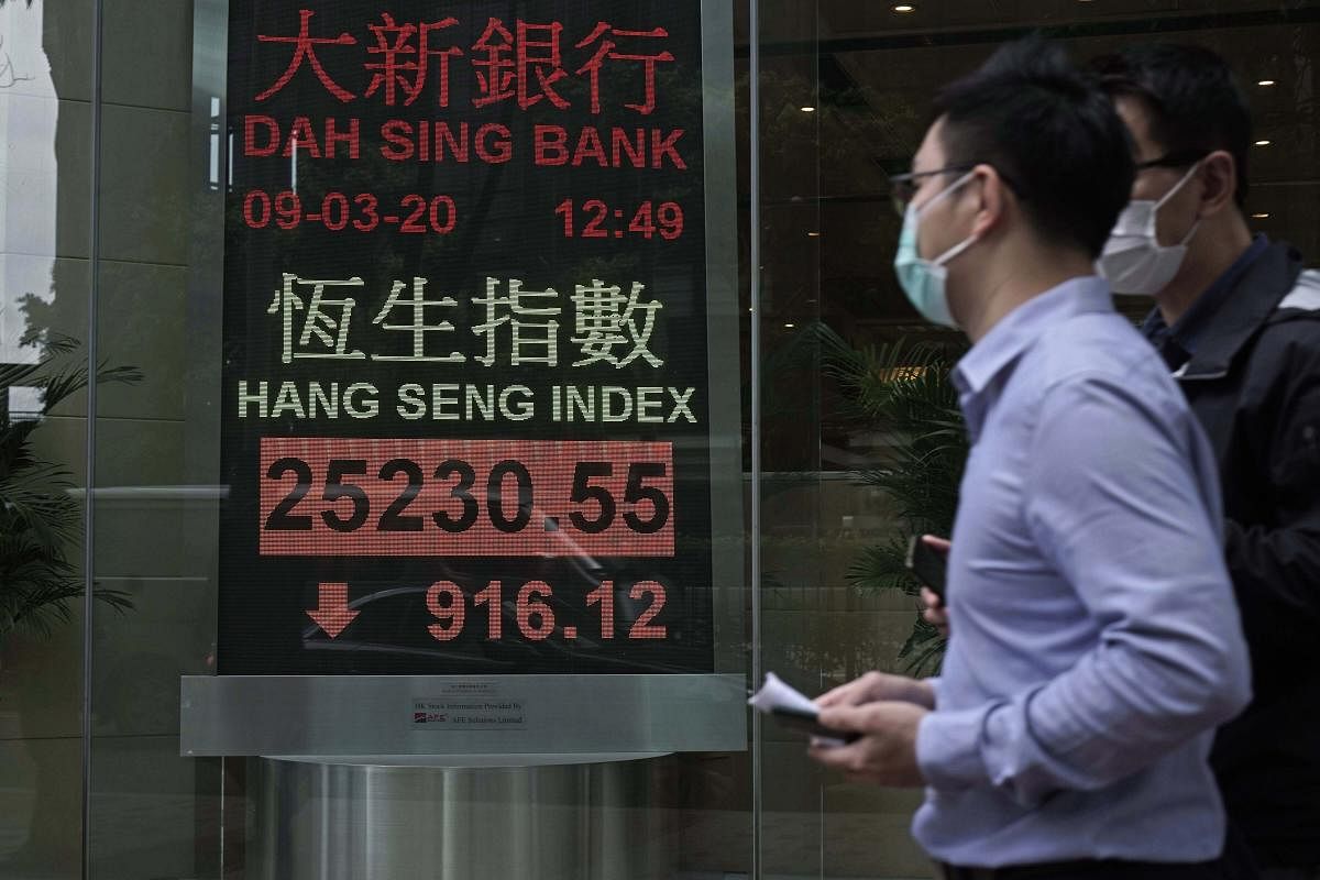  Asian stock markets have plunged after global oil prices nosedived on fears the global economy weakened by a virus outbreak might be awash in too much crude. (AP Photo)