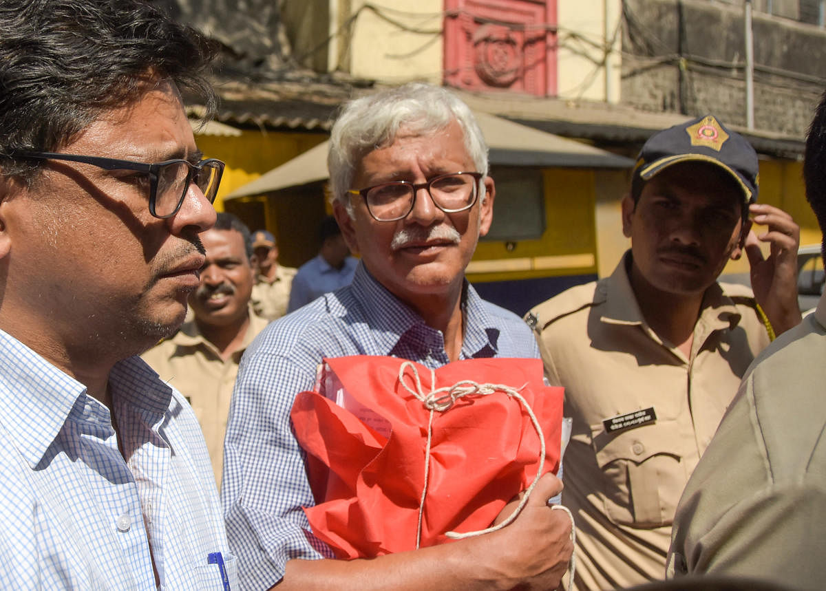 Vernon Gonsalves, one of the accused in the Bhima Koregaon violence case, is escorted by police to court for a hearing, in Mumbai. (PTI File Photo)