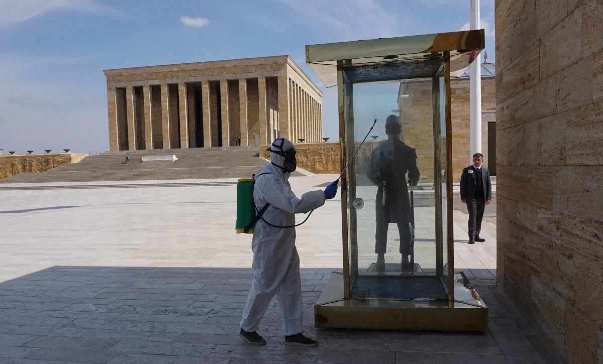 A city employee disinfects Anitkabir, the mausoleum of the founder of the Turkish Republic Mustafa Kemal Ataturk, in Ankara (AFP Photo)