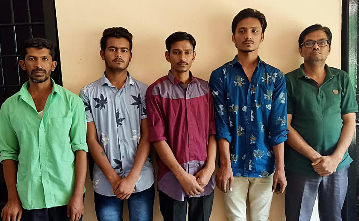 The suspects arrested for stealing jewellery from the house of a businessman in Hanumanthanagar.