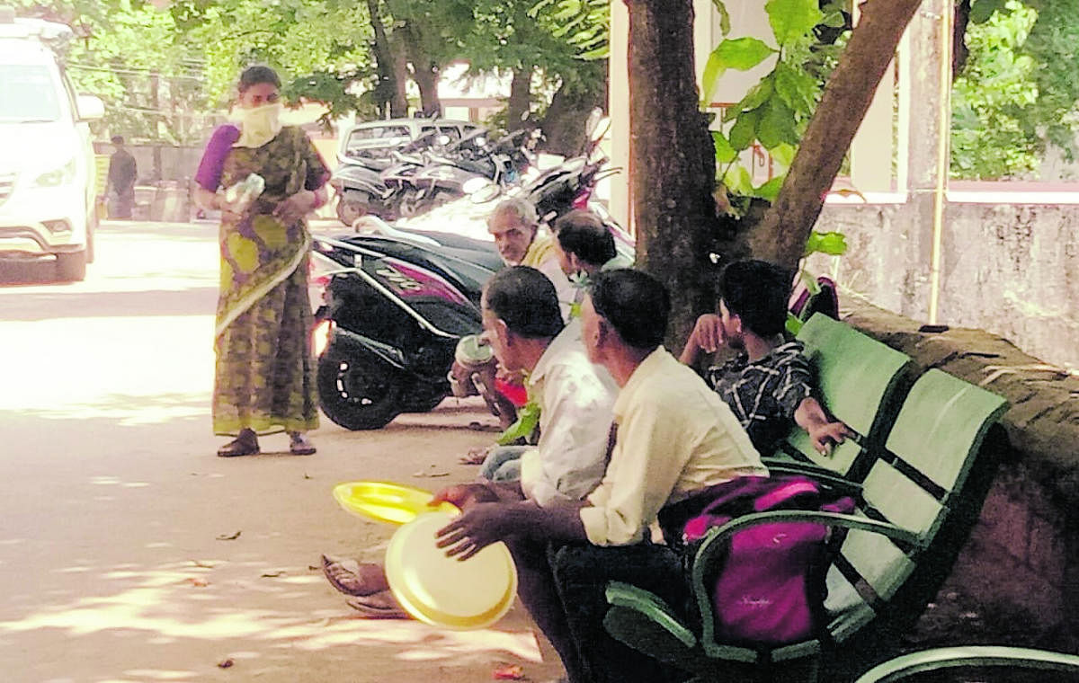 Attendants wait with empty plates on the premises of District Wenlock hospital unaware that Snehalaya Charitable Trust had cancelled its ‘Snehalaya Maanna’ (free mid-day meals) due to Covid-19 crisis from Tuesday.
