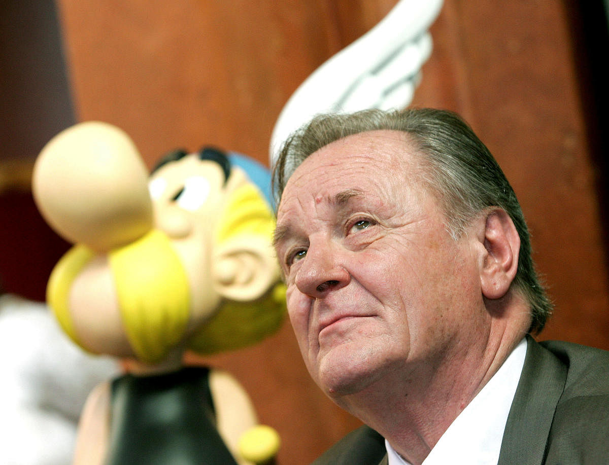 Albert Uderzo, the artist of all thirty-three Asterix adventures and story writer of the last nine books, sits next to a model of Asterix during a news conference in Brussels September 22, 2005. (Reuters Photo)