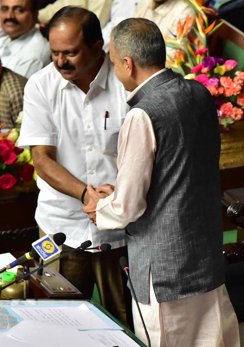 Legislative Assembly Speaker Vishweshwar Hegde Kageri greets BJP legislator Anand Mamani who was unanimously elected as the deputy speaker on Tuesday.