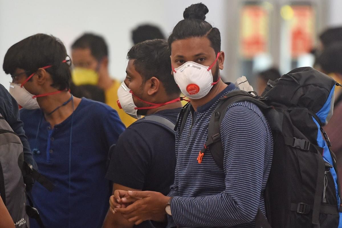 Passengers wearing facemasks amid concerns over the spread of the COVID-19 in Goa (AFP Photo)