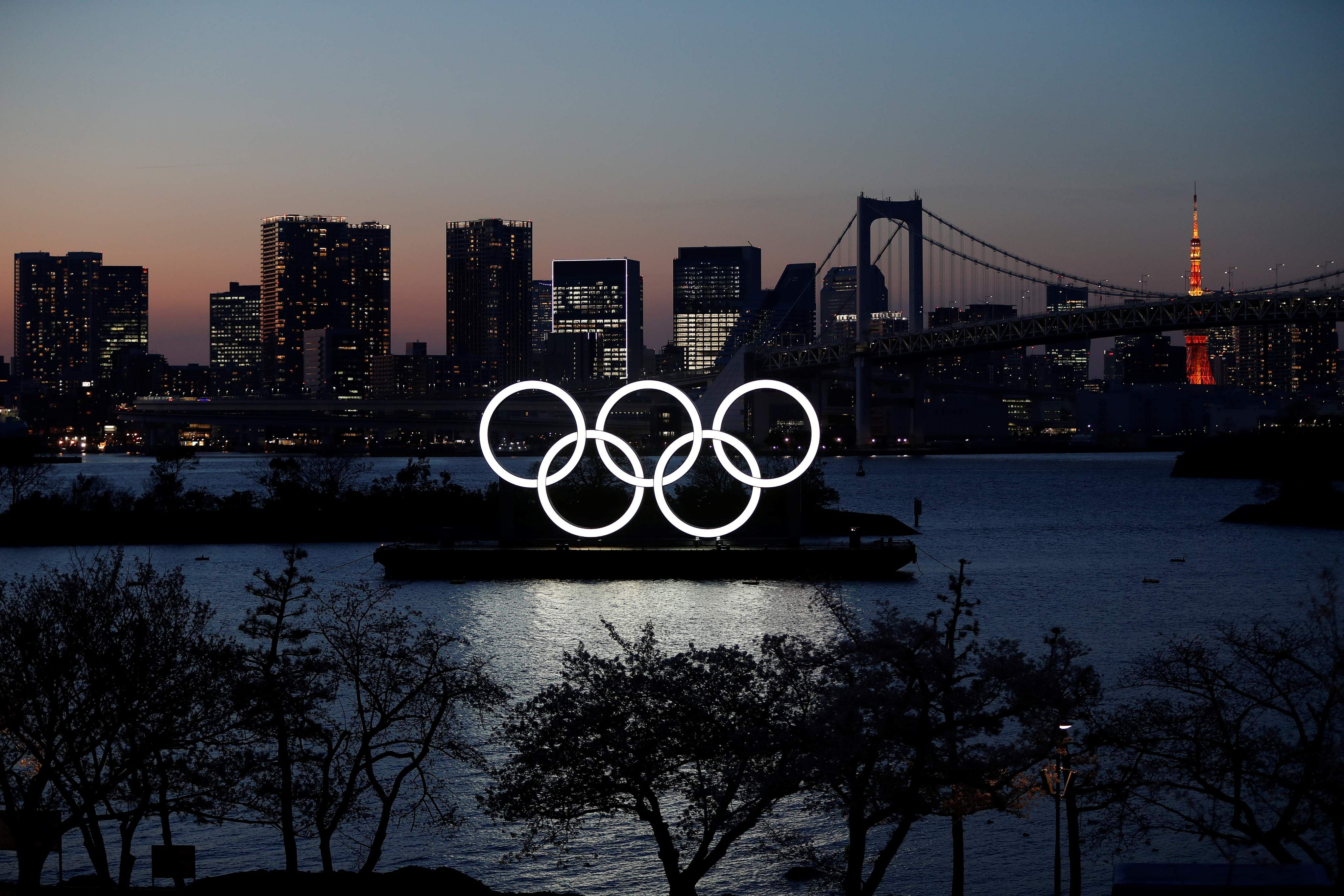 The giant Olympic rings are seen through at the waterfront area at Odaiba Marine Park. (Credit: Reuters)