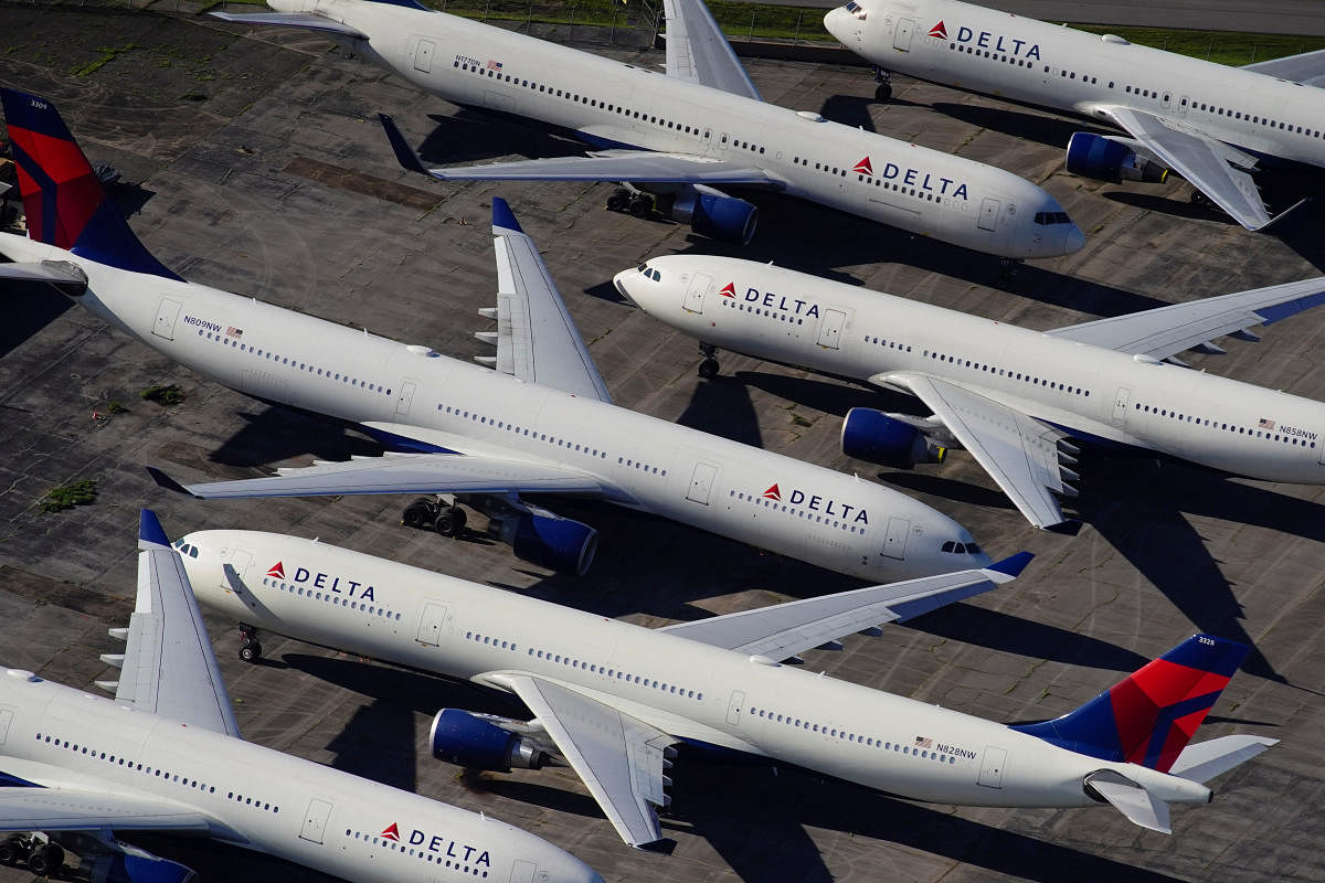 Delta Air Lines passenger planes are seen parked due to flight reductions made to slow the spread of coronavirus disease (Reuters Photo)