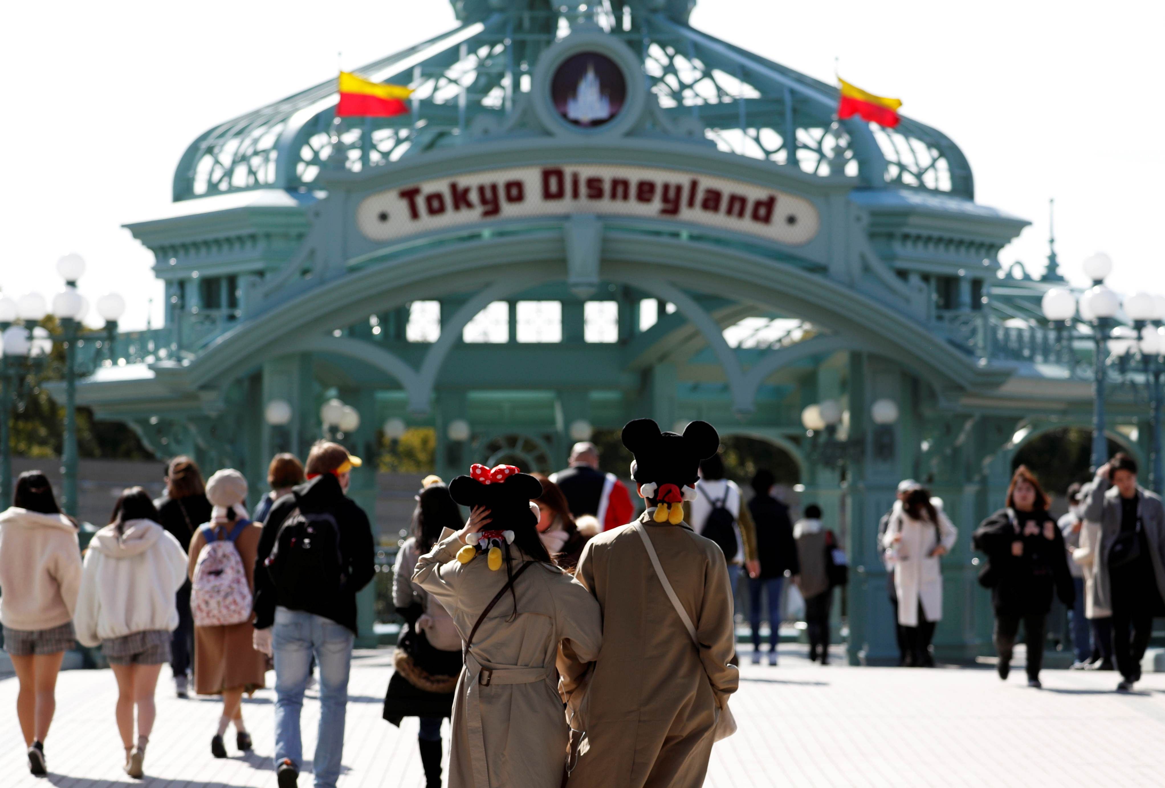 Visitors are seen outside Tokyo Disneyland. (Credit: Reuters)
