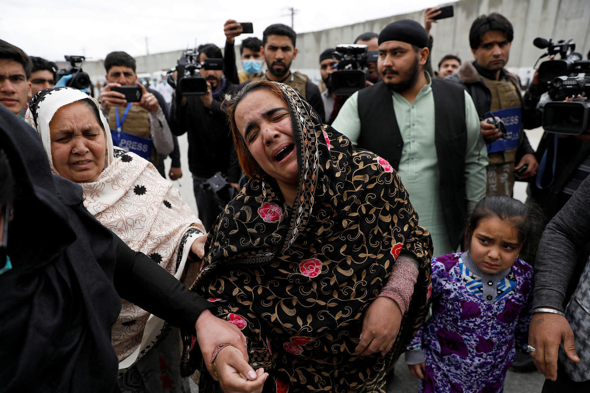 An Afghan Sikh woman mourns for her relatives near the site of an attack in Kabul. Credit: Reuters File Photo