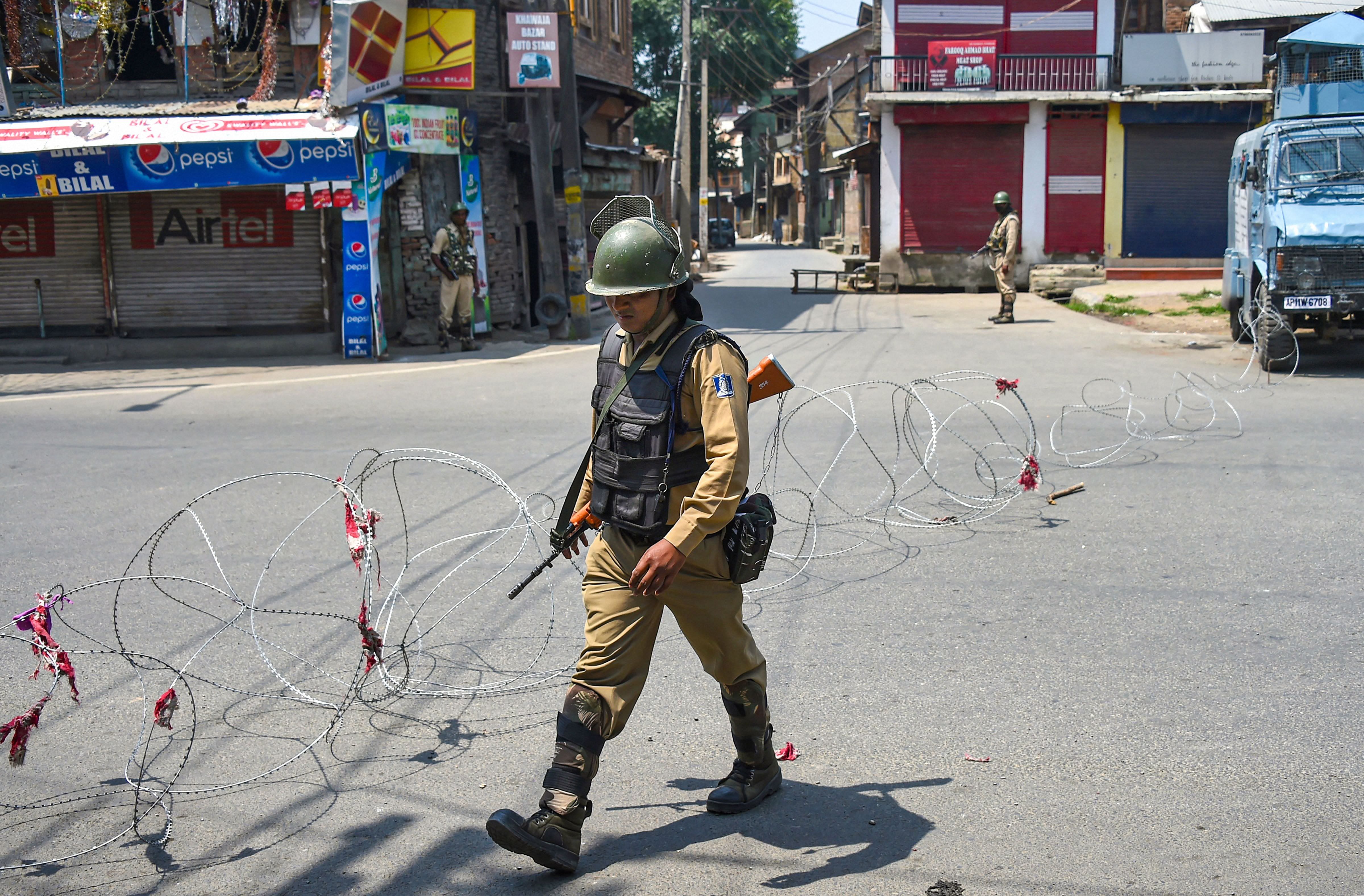 CRPF personnel stand guard during a strike called by separatist leaders on the third death anniversary of Hizbul Mujahideen militant commander, (PTI file photo)