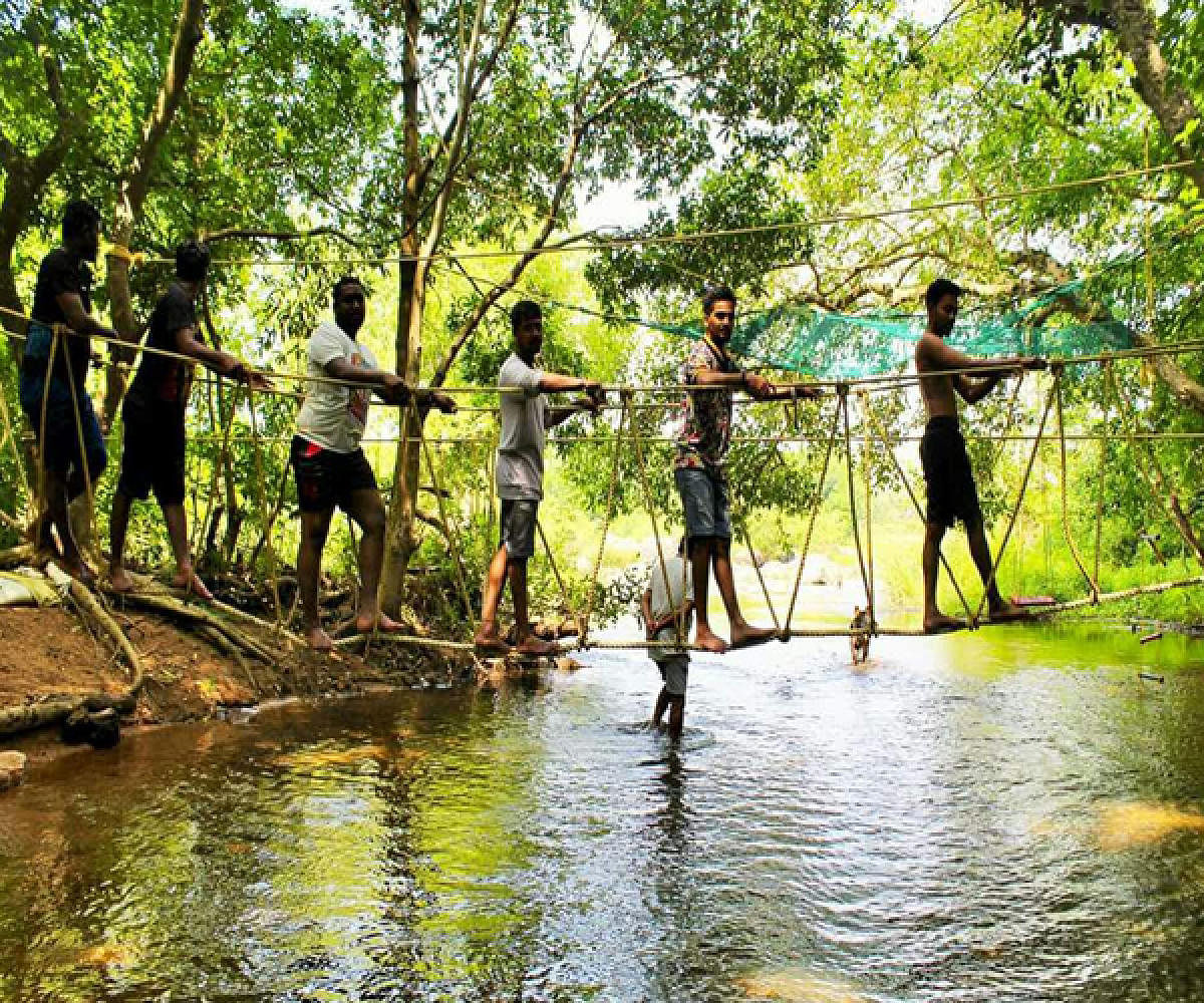 Rope bridge crossing as part of several activities lined up for the NADi river festival in Sakleshpur