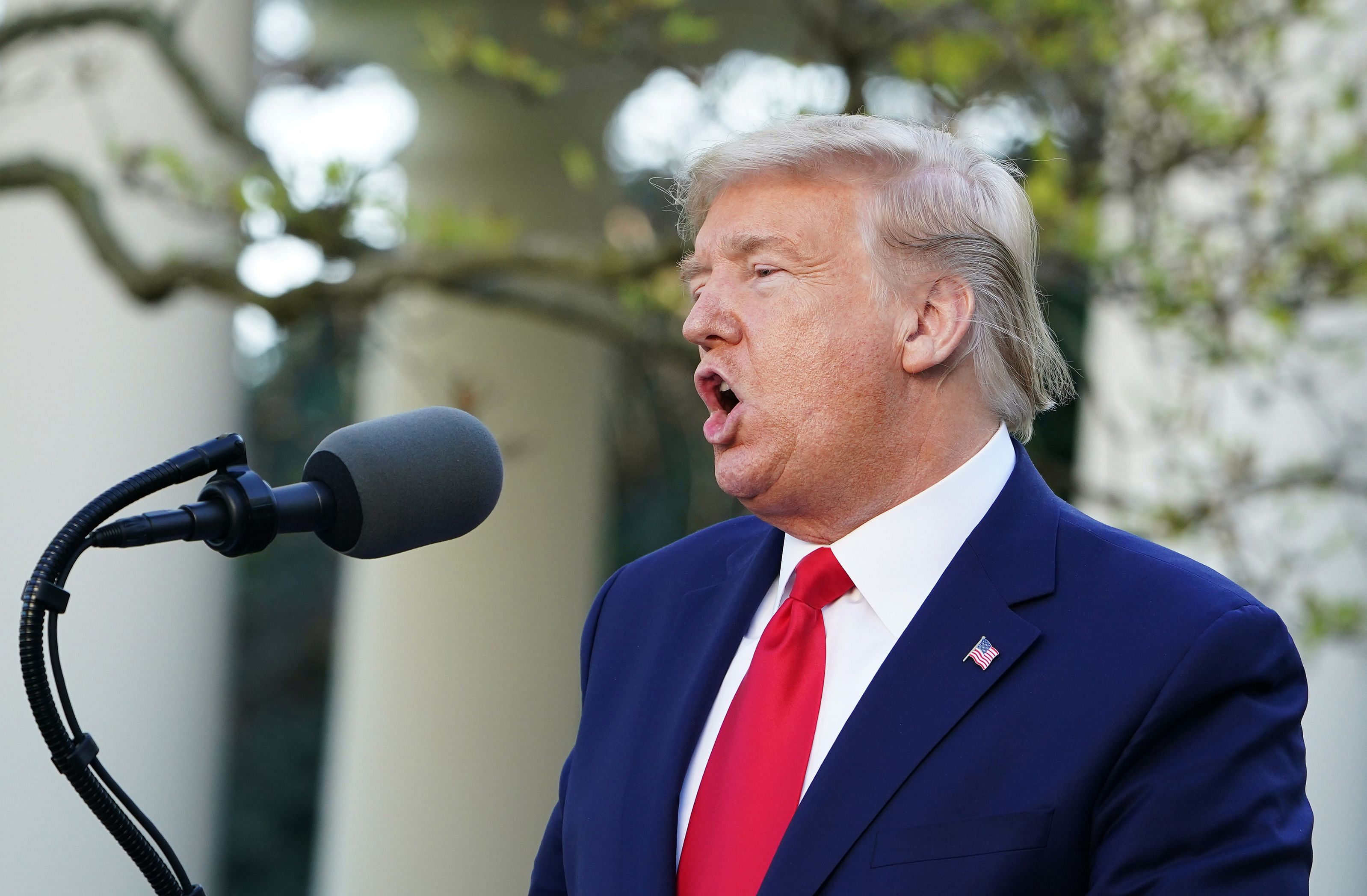 The governor has been guarded in his criticism of the president's handling of the crisis, which Trump had initially brushed off as being like influenza. (Credit: AFP Photo)