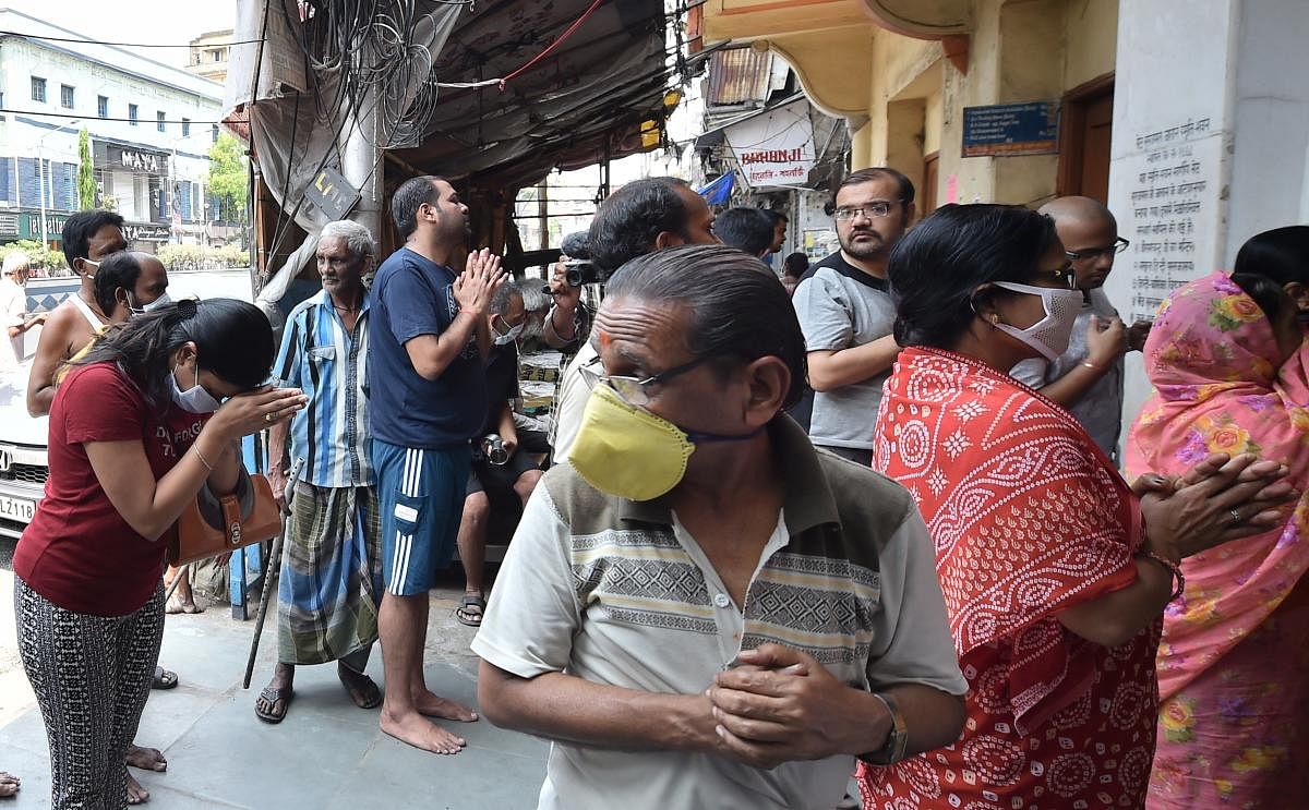 Devotees offer prayers outside a closed temple on the occasion of 'Ram Navami' during a nationwide lockdown in the wake of coronavirus pandemic in Kolkata, Thursday, April 2, 2020. (PTI Photo)